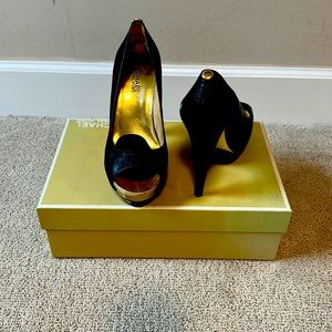 Classic black Michael Kors stilettos. 4 1/2 inches high with platform in front.